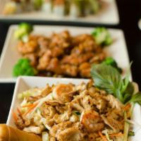 General Tao Chicken · Battered white meat chicken served in a spicy honey brown sauce, onion and bell pepper. Serv...