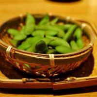 Edamame · The pods are boiled served with salt .