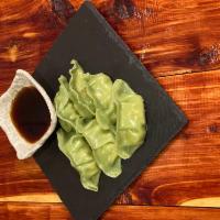 Vegetable Gyoza · Vegetarian dumplings can choose of steam or fried .