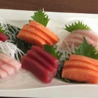 D04. Tricolor Sashimi · 4 pieces tuna, 4 pieces salmon and 4 pieces yellowtail. Served with miso soup and salad.