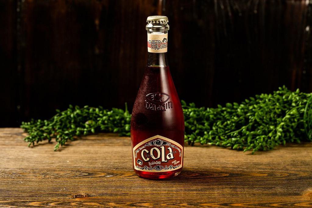 Cola Baladin · Classic cola flavor with citrus aromas from oranges and lemons, with a hint of cinnamon, coriander, cardamom, nutmeg, and other spices.