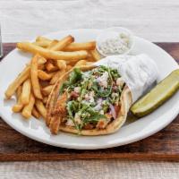 Mediterranean Chicken Pita · Breaded chicken with arugula, diced tomato, red onion, crumbled feta cheese and balsamic vin...