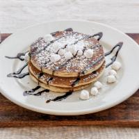 Smores Pancakes · Chocolate chips, mini marshmallows, graham cracker crumbs and chocolate sauce.