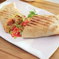 Chicken Shawarma · A west african twist on a familiar middle eastern delicacy. Contains fresh pita bread, cabba...