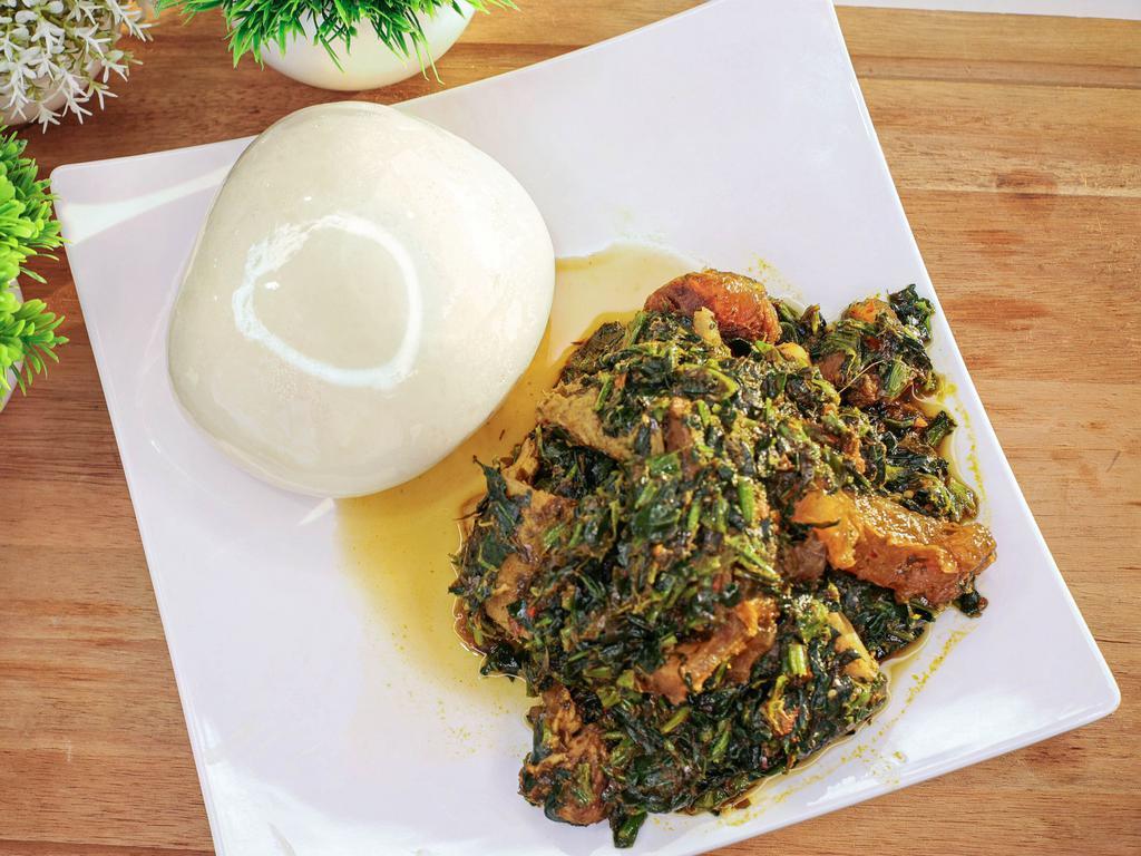 Vegetable Soup with Pounded Yam · Traditional West African Okra Soup slow cooked to perfection complete with Pounded Yam.
