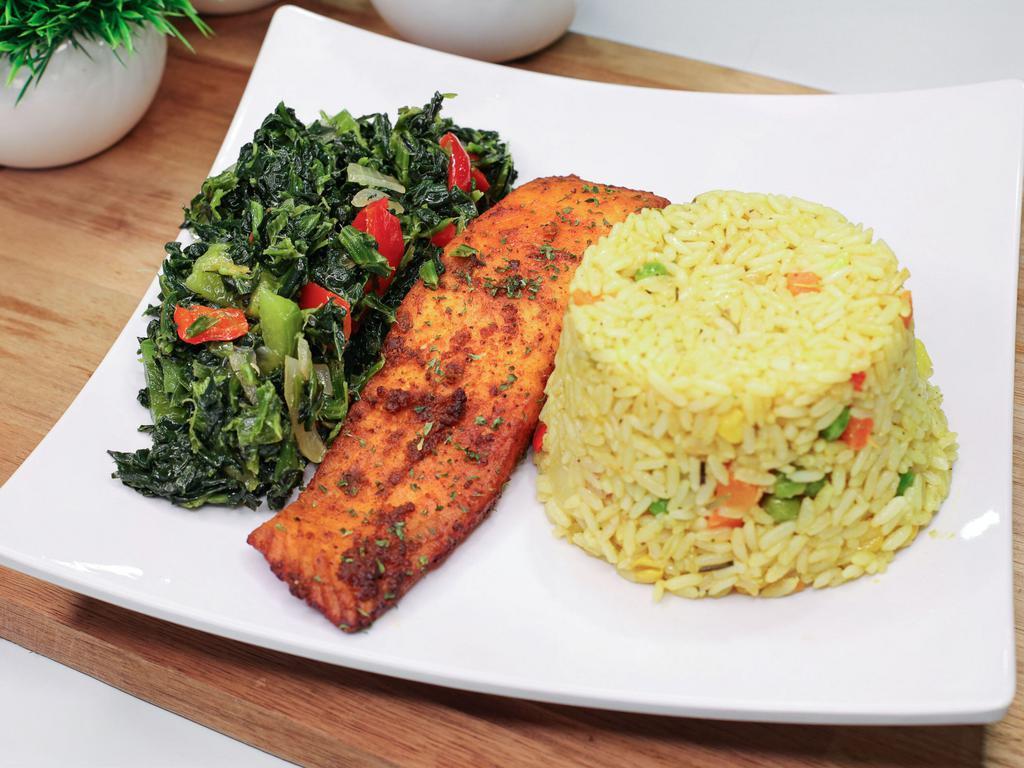 Grilled Salmon with Fried Rice &v Cabbage · Grilled succulent salmon with a side of freshly made cabbage and fried rice slow cooked to perfection.