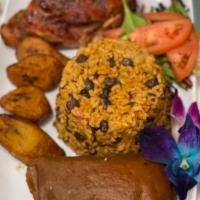 Plato Tropical Tradicional Dinner · Traditional tropical dish. Roast pork, yellow rice and pigon beans, pastel, potatoes salad, ...