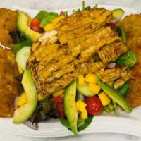 Isabela Pollo Tropical con Mango Salad · Tropical Isabela chicken mango salad. Spicy chipotle grilled chicken, mixed greens, diced ma...