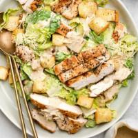 Grilled Chicken Caesar Salad · Tender grilled chicken, fresh romaine, croutons, Parmesan cheese, and Caesar dressing.
