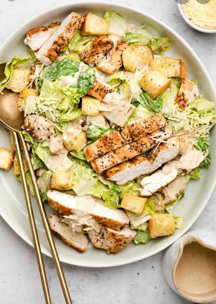 Grilled Chicken Caesar Salad · Tender grilled chicken, fresh romaine, croutons, Parmesan cheese, and Caesar dressing.