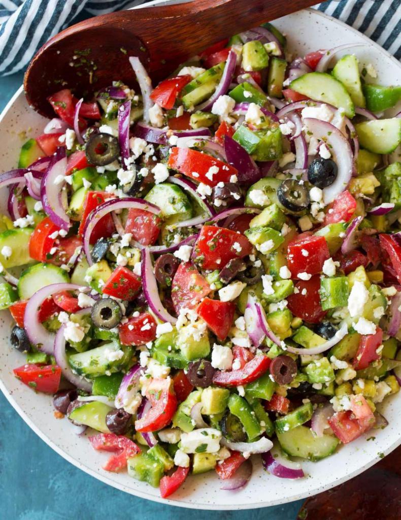 Greek Salad · Mixed greens, feta cheese, red onion, green olive, tomato, cucumber, olive oil, and vinegar.