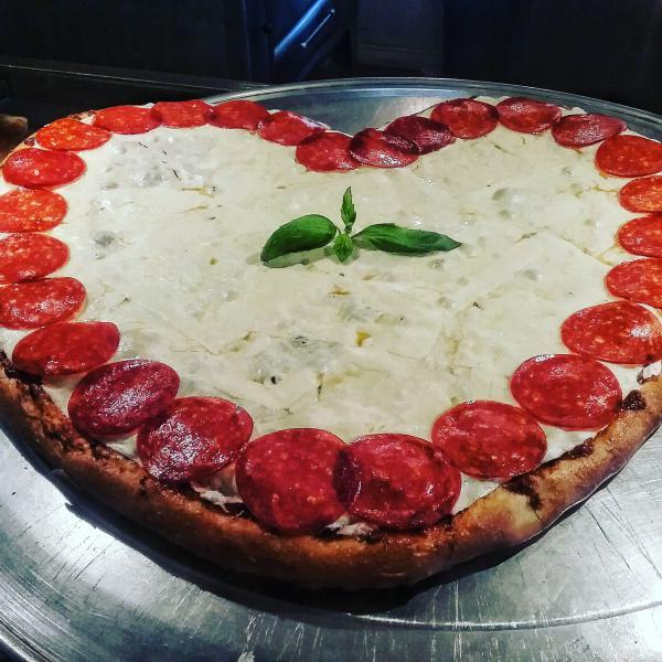 Margherita Pizza · Fresh mozzarella, fresh basil and garlic, peeled plum tomatoes and pecorino Romano cheese.