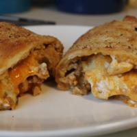 Chicken Calzone · Personal size. A baked or fried turnover of pizza dough stuffed with chicken.