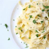 Fettuccini Alfredo · Fettuccini with rich butter and Parmesan sauce.