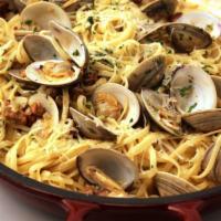 Linguini Clams Sauce · Ribbon pasta with clams sauce. Choice white or red.