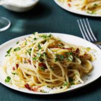 Spaghetti ala Carbonara · Onions, bacon and cream sauce.