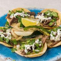 Carne Asada Tacos (5) · Carne asada on a corn tortilla topped with onions and cilantro, limes and one side of salsa ...