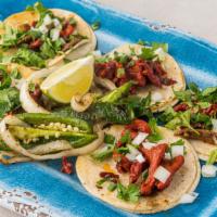 Campechanos Tacos (5) · Mix of pastor and asada on a corn tortilla topped with onions and cilantro, limes and one si...