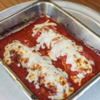 Meatball Parmigiana · Oven-baked and topped with mozzarella cheese.