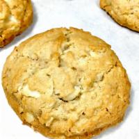 Macadamia Nut Cookie -  1 Cookie (2.75oz/78g) · Packaged and sealed crisp, buttery, cake-like cookie full of macadamia nuts, coconut flakes,...