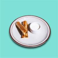 Kid's Rolled Quesadilla · Choice of chicken or ground beef. Two crisped flour tortillas, cheddar cheese, side of crema.