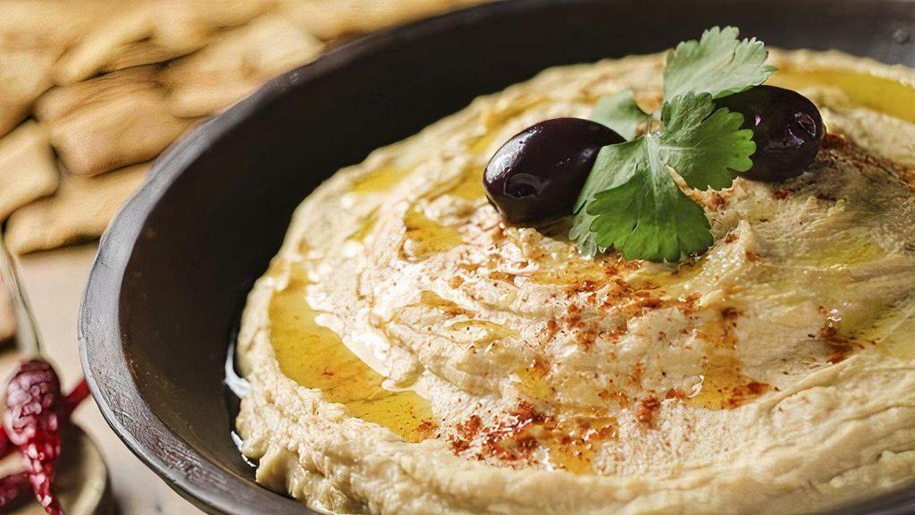 Hummus · Mashed chickpeas blended with tahini garlic.