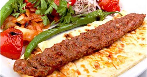 Lamb Adana Pita Sandwich · Sandwich with minced lamb that was cooked on a kabob served in a unleavened flatbread. 