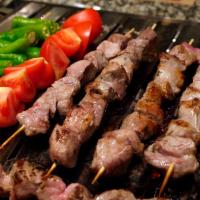Lamb Shish Pita Sandwich · Cubes of lamb cooked on a skewer served in a unleavened flatbread. 