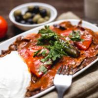 Alexander Kebab · Iskender. Turning grilled meat served with plain yogurt and tomato sauce, grilled tomatoes, ...