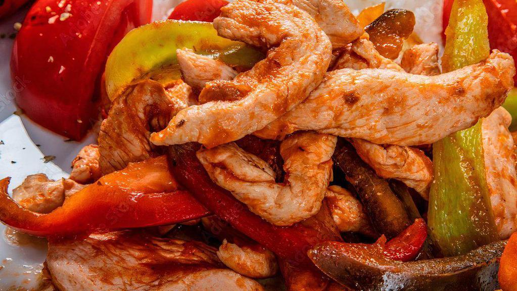 Chicken Saute · Onions, green peppers and red peppers with rice.