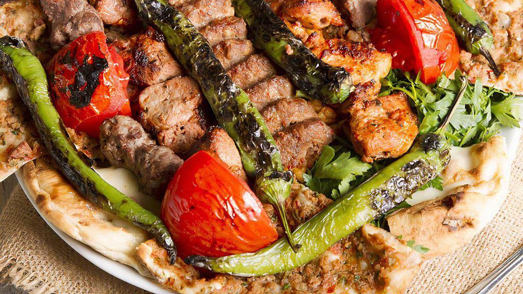Mixed Lamb Grill Entree · Lamb shish, lamb adana, lamb chops, lamb gyro, and beef meatball served with rice, grilled tomatoes, and peppers.