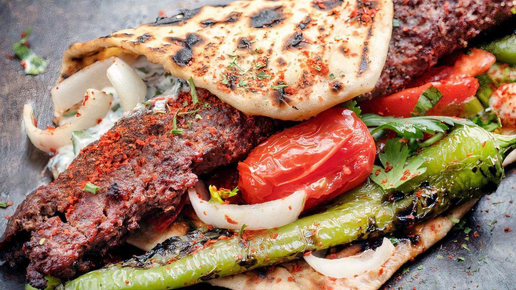 Adana Kebab Entree · Ground lamb, red peppers, herbs and spices served char-grilled on skewers.
