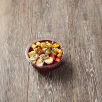 The Classic Acai Bowl · Organic acai berry blend thick with strawberry and banana and blue berry. Toppings are organ...