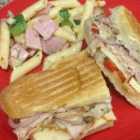 Umbria Sub · Roast pork, Asiago, roasted red peppers, onion and basil oil. Served on an 8