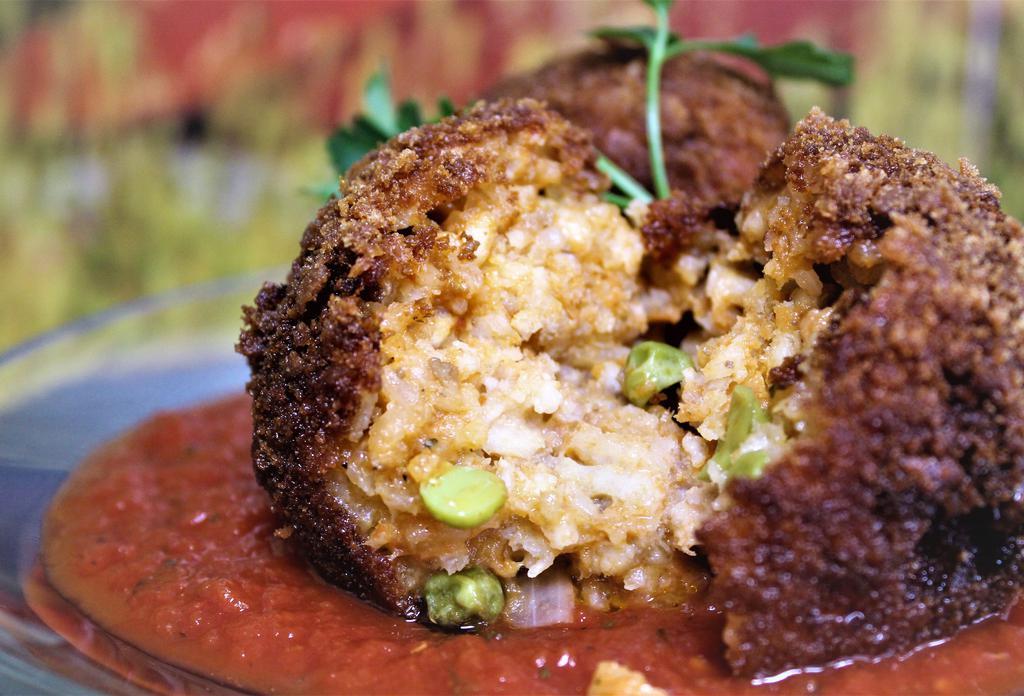 Arancini · Homemade Sicilian style arancini made with creamy risotto, cheeses and all natural ingredients. Choose 1 with sauce and a cold side salad.
