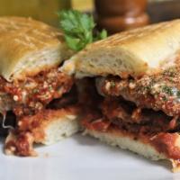 Eggplant Parmigiana · Skinless slices of eggplant breaded and fried.  Topped with our homemade sauce and mozzarell...