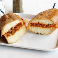 Kitfo Sandwich · Fresh minced lean beef seasoned in house butter and dried ground chili pepper and spices.