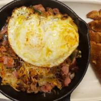 Grilled A Skillet Breakfast · Ham, bacon, sausage, grilled jalapenos, onion, and tomatoes topped with cheese and 2 eggs an...