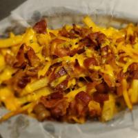 Bad Ass Fries · Home fries with cheddar cheese, chopped bacon and chives.