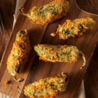 Homemade Fried Jalapenos · Hand breaded, whole, fresh Jalapenos filled with cream & cheddar cheese, onion and green oni...