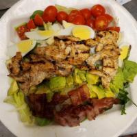 Cobb Salad · Mixed greens, grilled chicken, tomato, crisp bacon, hard boiled eggs, avocado, blue cheese o...