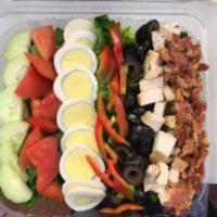 Cobb Salad · Black olives, grilled chicken, bacon, tomato, cucumbers, gr-peppers, hard boiled eggs, cheese.