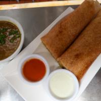 Dosa · Crispy grilled rice and lentil crepe, served with Sambar(lentil soup) and your choice of stu...