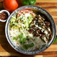 Beef Tikka Plate · Marinated beef pieces with a side of rice and salad. 