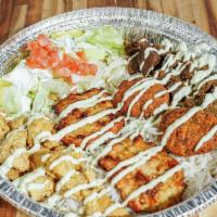Mixed Plate · Falafel, Chapli kabob, marinated beef, and marinated chicken with a side of rice and salad