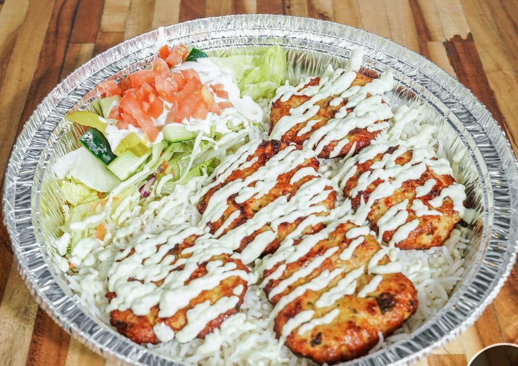 Chicken Chapli Kabob Plate · Chicken Chapli kabob (ground chicken mixed with spices, formed into a patty) with a side of rice and salad