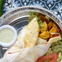 Chicken Tikka Wrap · Marinated chicken, veggies, and yogurt sauce wrapped in our homemade naan. Comes with a side...