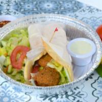 Falafel Wrap · Falafel, veggies, and yogurt sauce wrapped in our homemade naan. Comes with a side of salad.