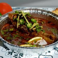 Lamb Shank Nihari · Braised lamb shank slow cooked in a stew of broth, served with a naan.