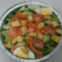 Tossed Salad · A blend of romaine and iceberg lettuce topped with carrots, cucumbers, egg, tomatoes, and cr...